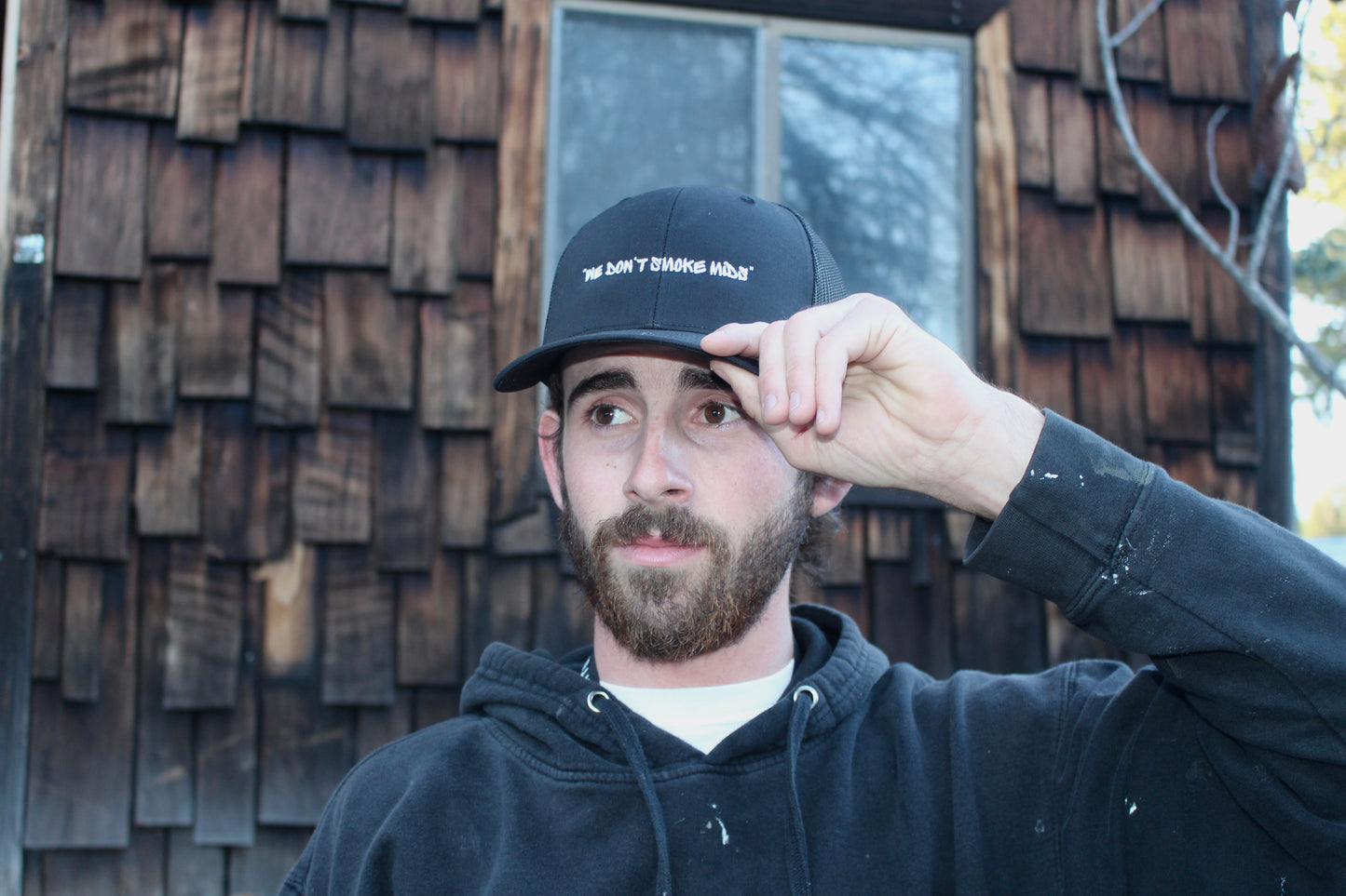 "We Don't Smoke Mids" Trucker Hats