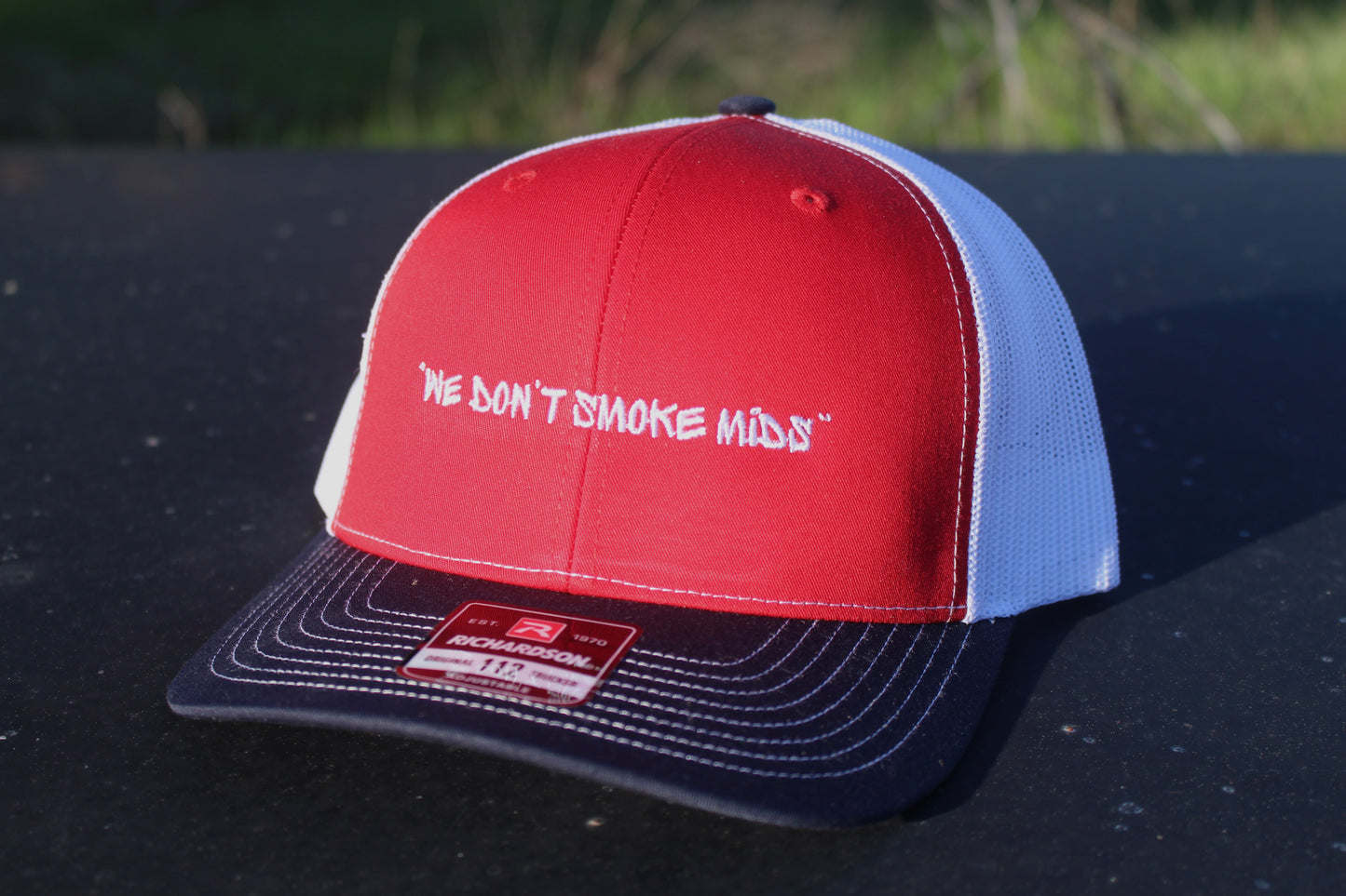 "We Don't Smoke Mids" Trucker Hats